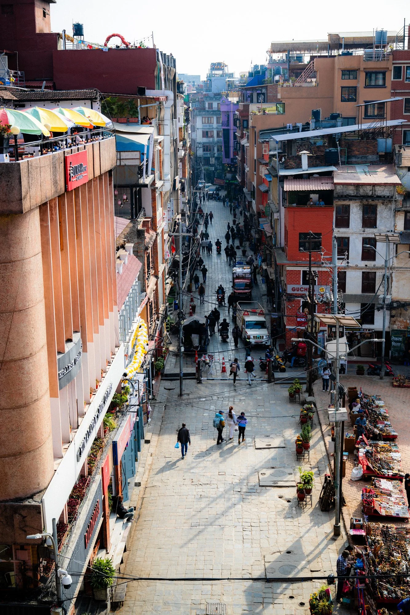 Markets, cafes, streets, alleys, life bustling below me.
