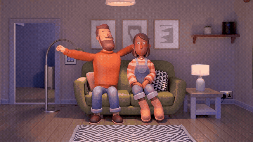 A 3D animated scene of a man and woman sitting on a green sofa in a living room, with the man happily stretching his arms and the woman sitting calmly. The room has a wooden floor, a patterned rug, a white side table with a lamp, framed artworks on t