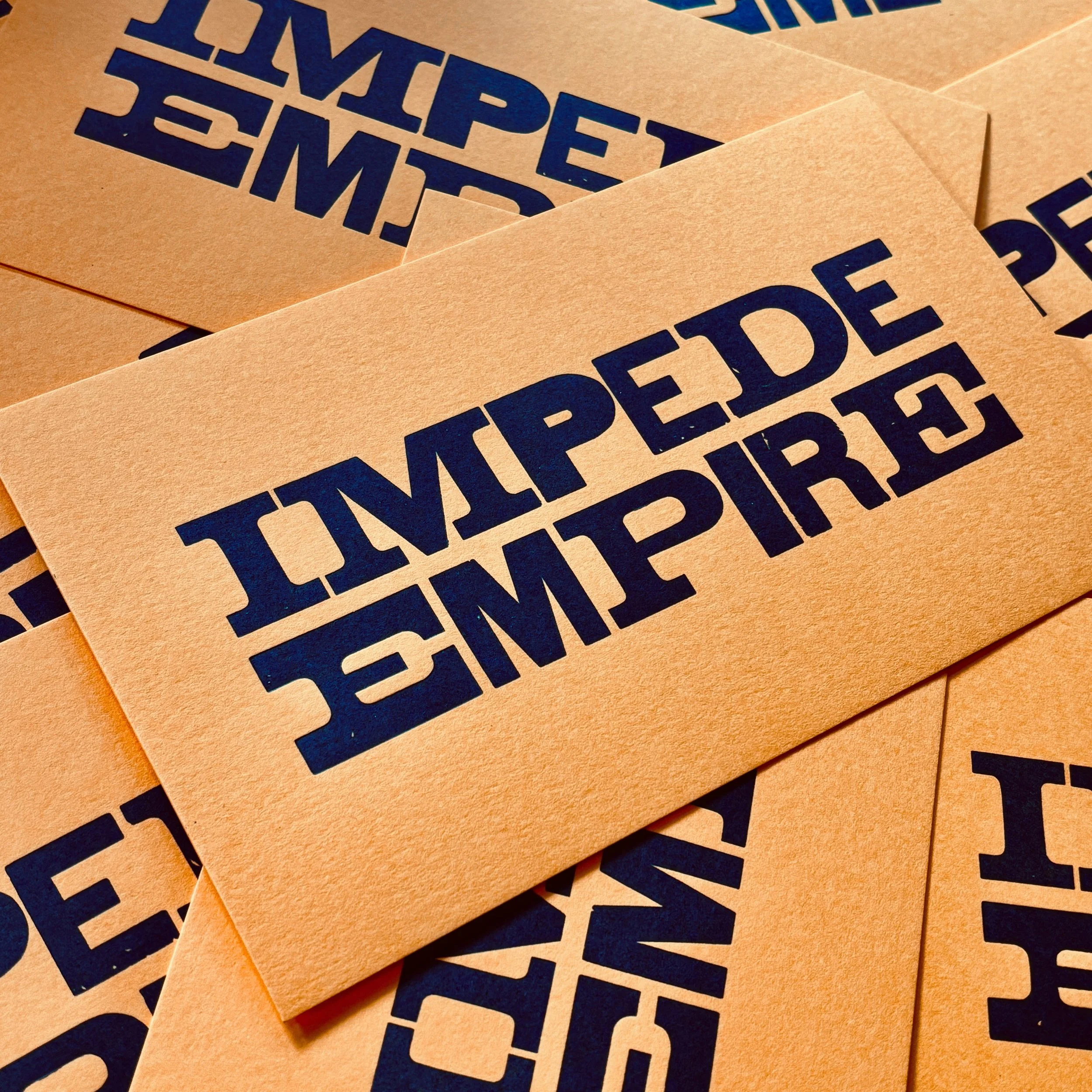 🔥JUST LISTED!🔥 IMPEDE EMPIRE | 5&times;8.5in letterpress print | Black ink on 111# Sun Glow cardstock | Hand-set wood type, printed on a Vandercook 4

This print is just another way to say: Be sand in the gears of empire&rsquo;s war machine. Make s