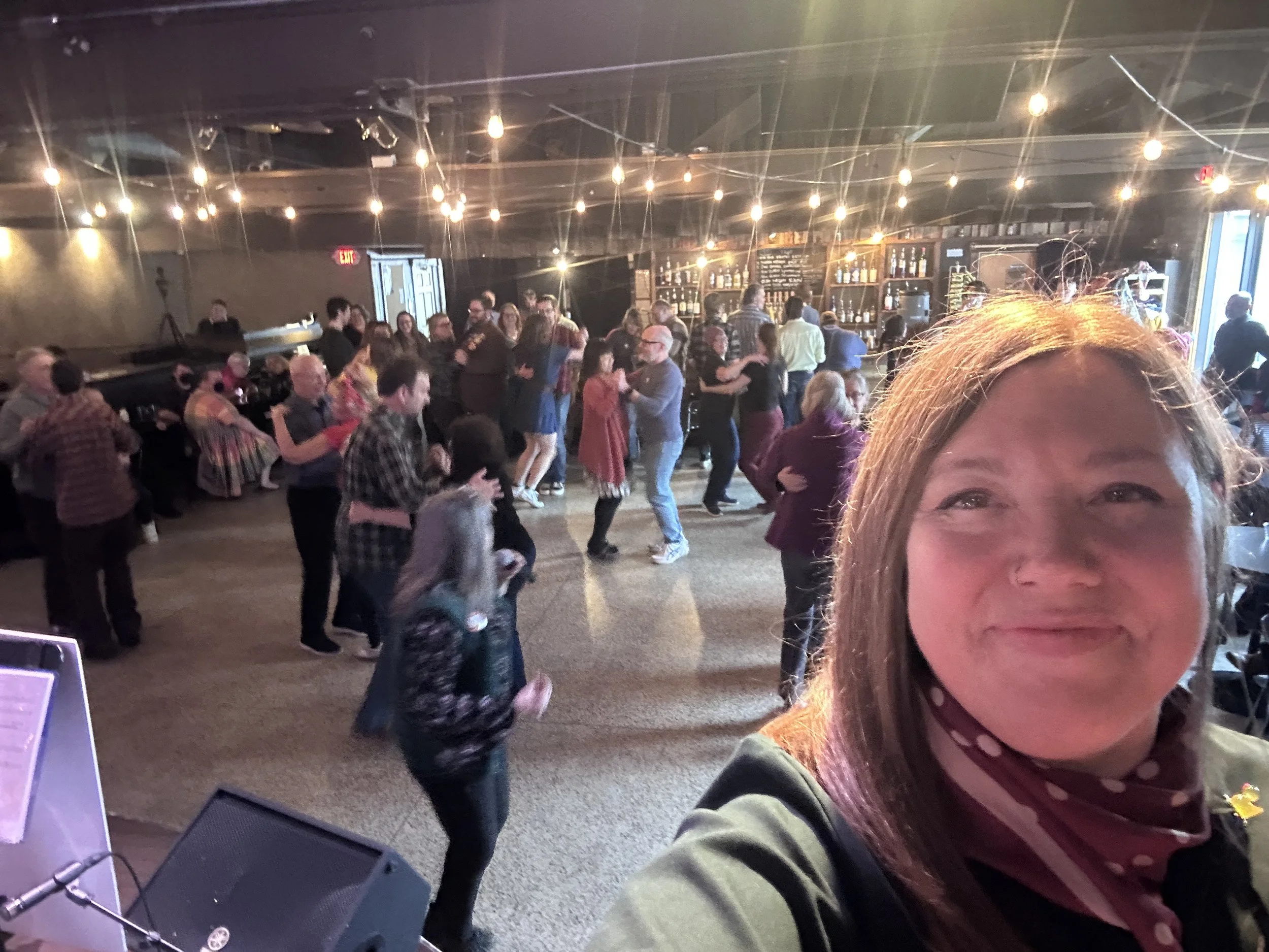 DJ Shotski takes a selfie in front of a polka-dancing crowd at the Bur Oak