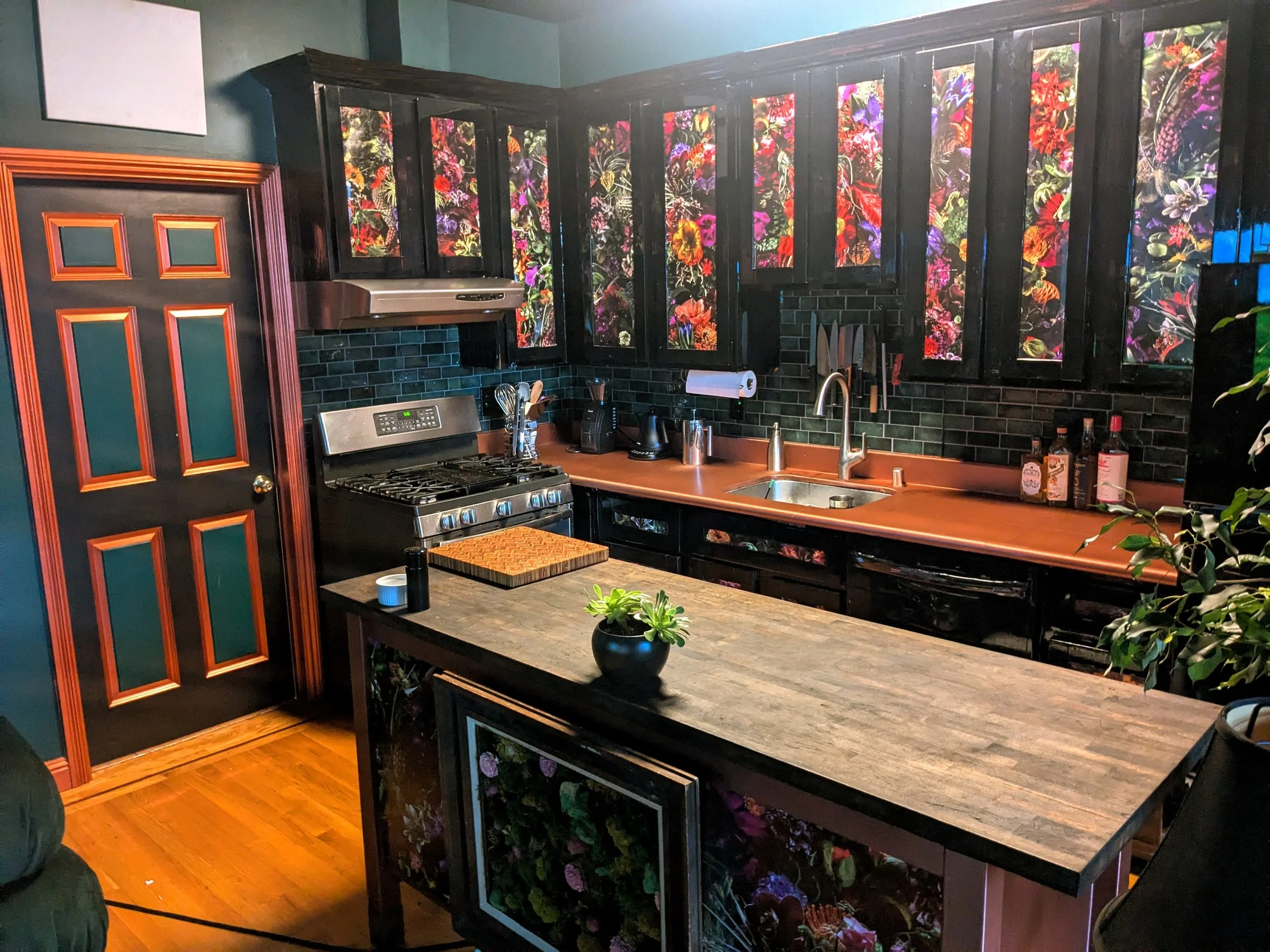 The cabinets were a real labor of love. A custom wallpaper print from Flavor Paper. The gloss black is vinyl wrap. Copper metallic countertop to match the trim. I'm slowly getting rid of all the silver things in my living room and kitchen.