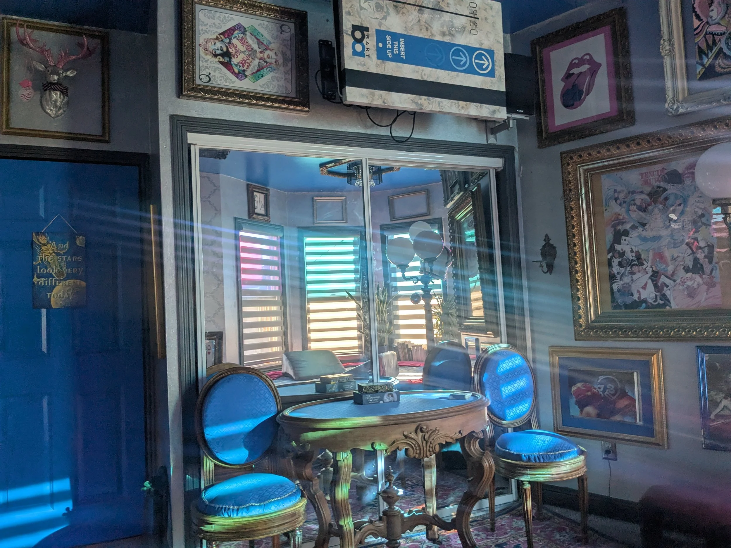 Tarot reading table. Antique Beaux style from the 1860 for the table and 1868 for the chairs. I bought them at an antique store and had Matthew Allen Design upholster them in blue playing card felt to match the cards and the queens.