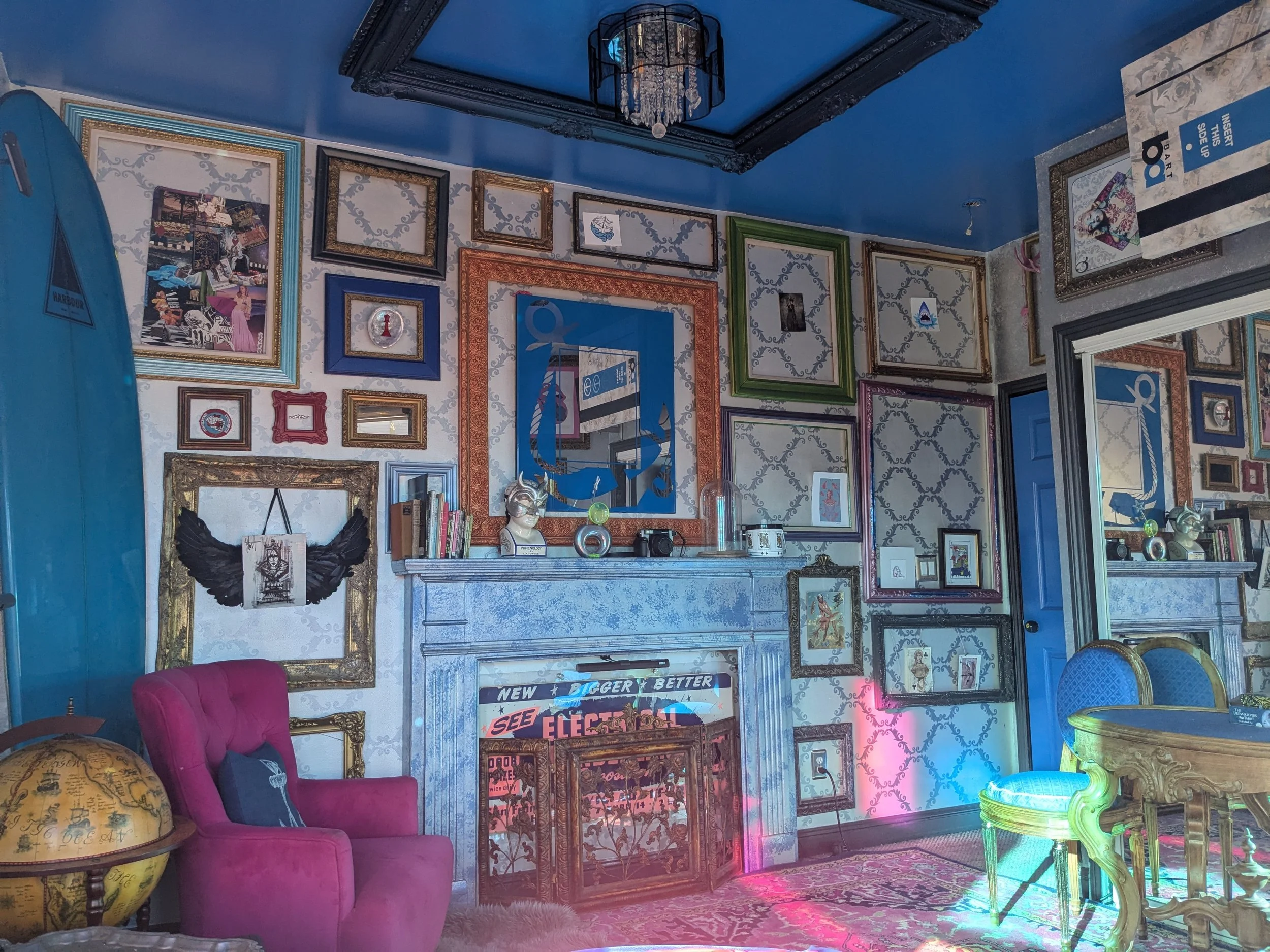 This the frame wall in the parlor. The paint is metallic silver, with a custom grey metallic stencil. I didn't want to hide all of my hard work behind art, so I cam up with the frame wall concept and have the art be small enough to float or hang in t