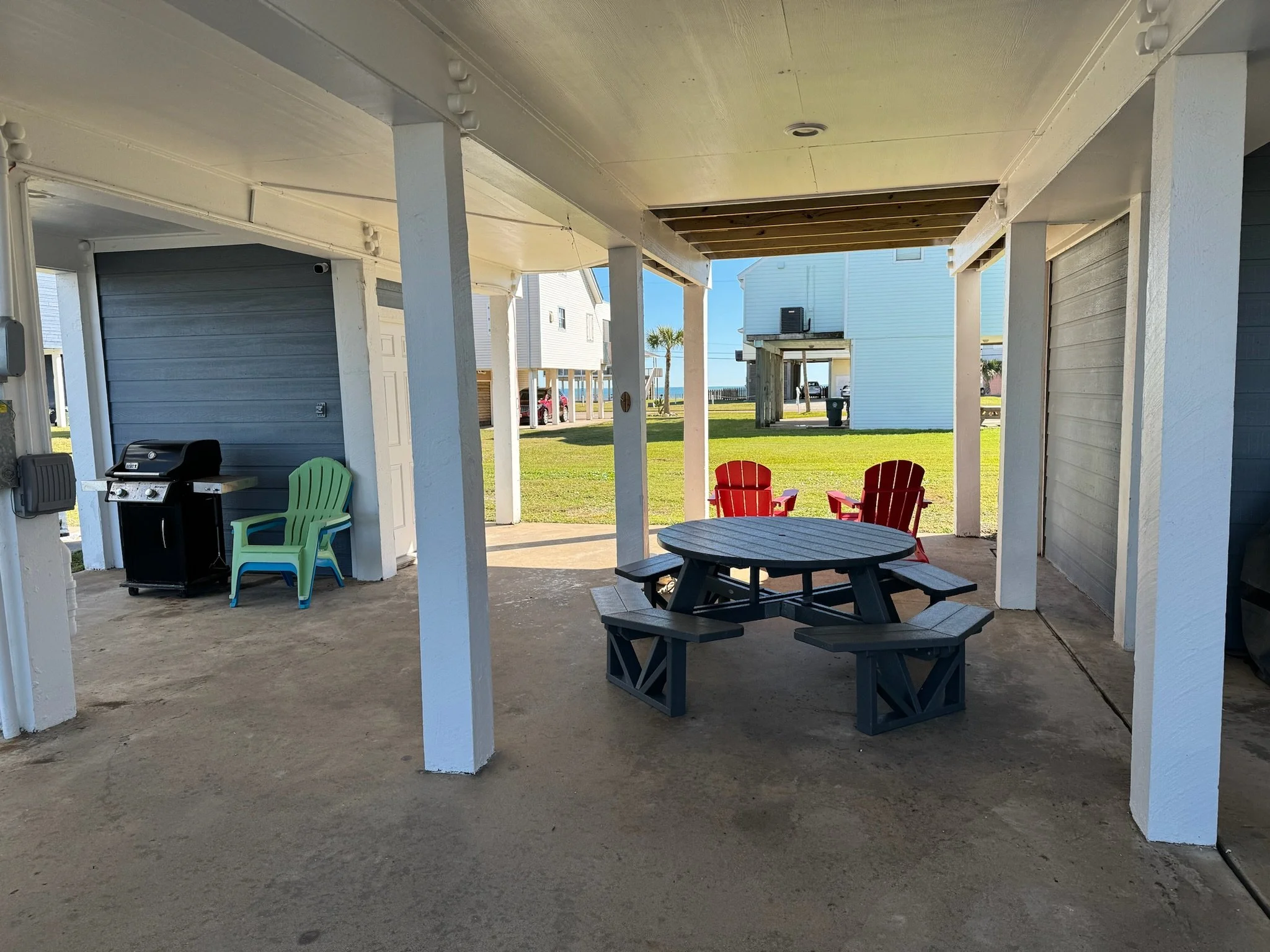 The ground floor is where you'll find a propane grill, picnic table, adirondack chairs, lounge chairs, and the storage shed. Inside the storage shed you'll find the beach wagon, beach chairs, yard games, and more!
