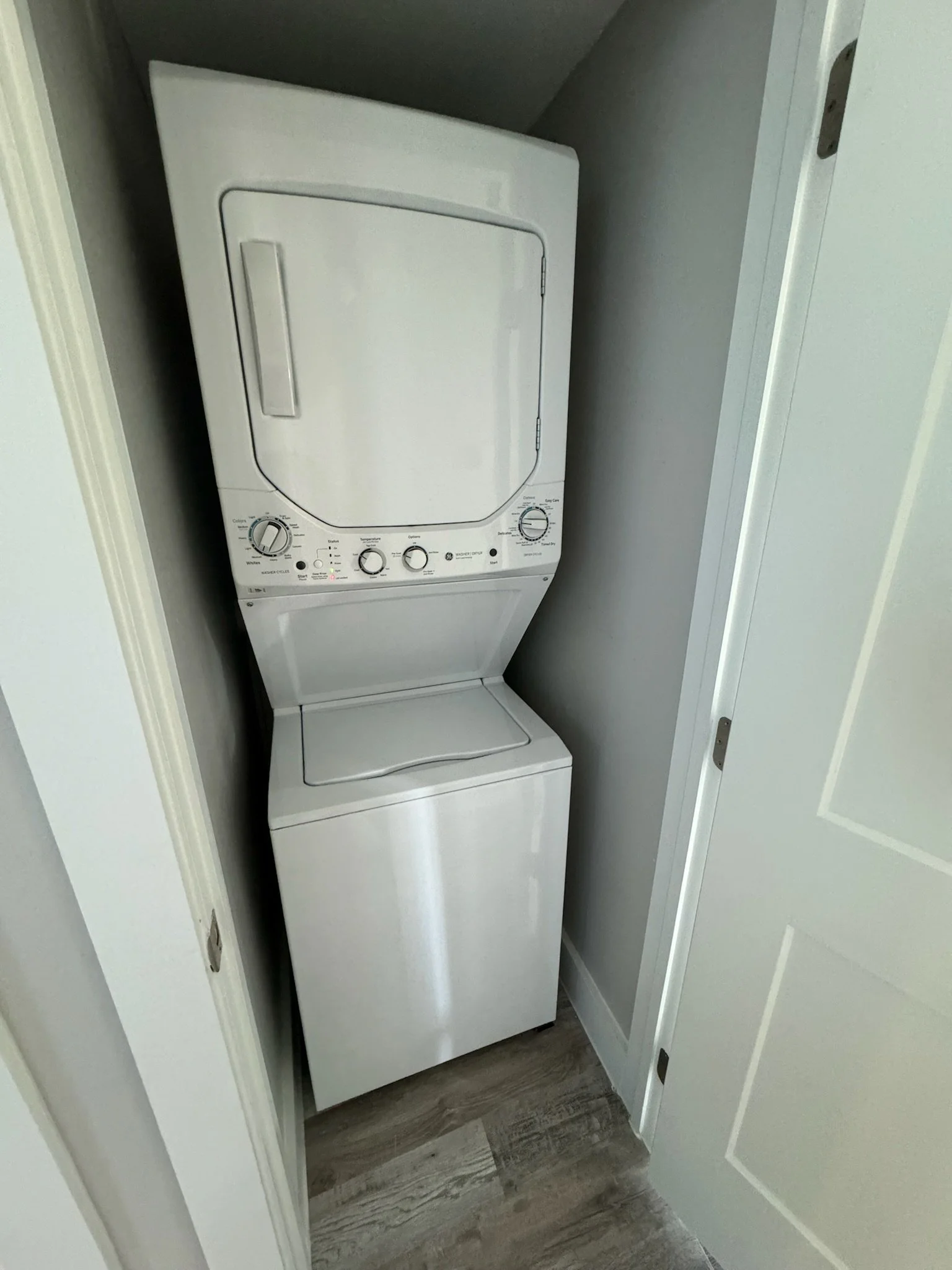 New stack laundry with laundry pods provided.