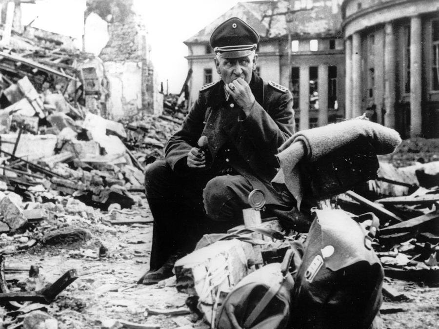 A German officer eats C-rations, ruins of Saarbrücken.jpg
