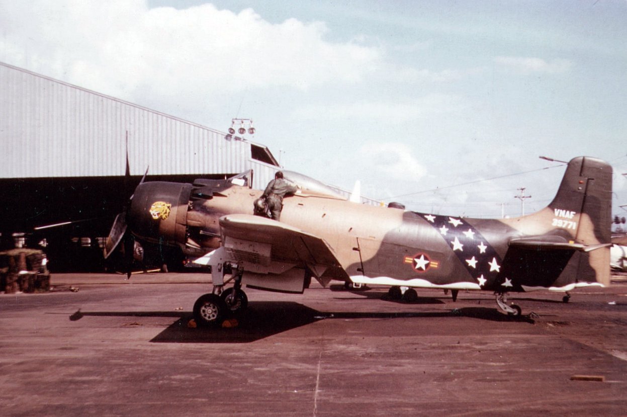 A-1H_VNAF_parked_in_front_of_hangar.jpeg