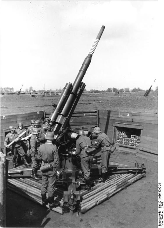 Luftwaffe soldiers loading an 8.8 cm FlaK gun.jpg