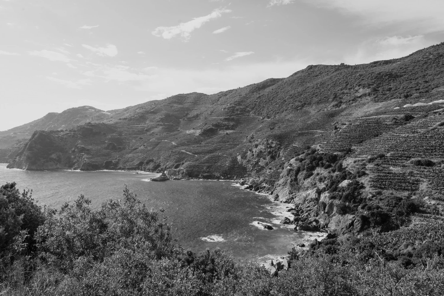 Rocky coastline in Greece, reated to the company’s name origin