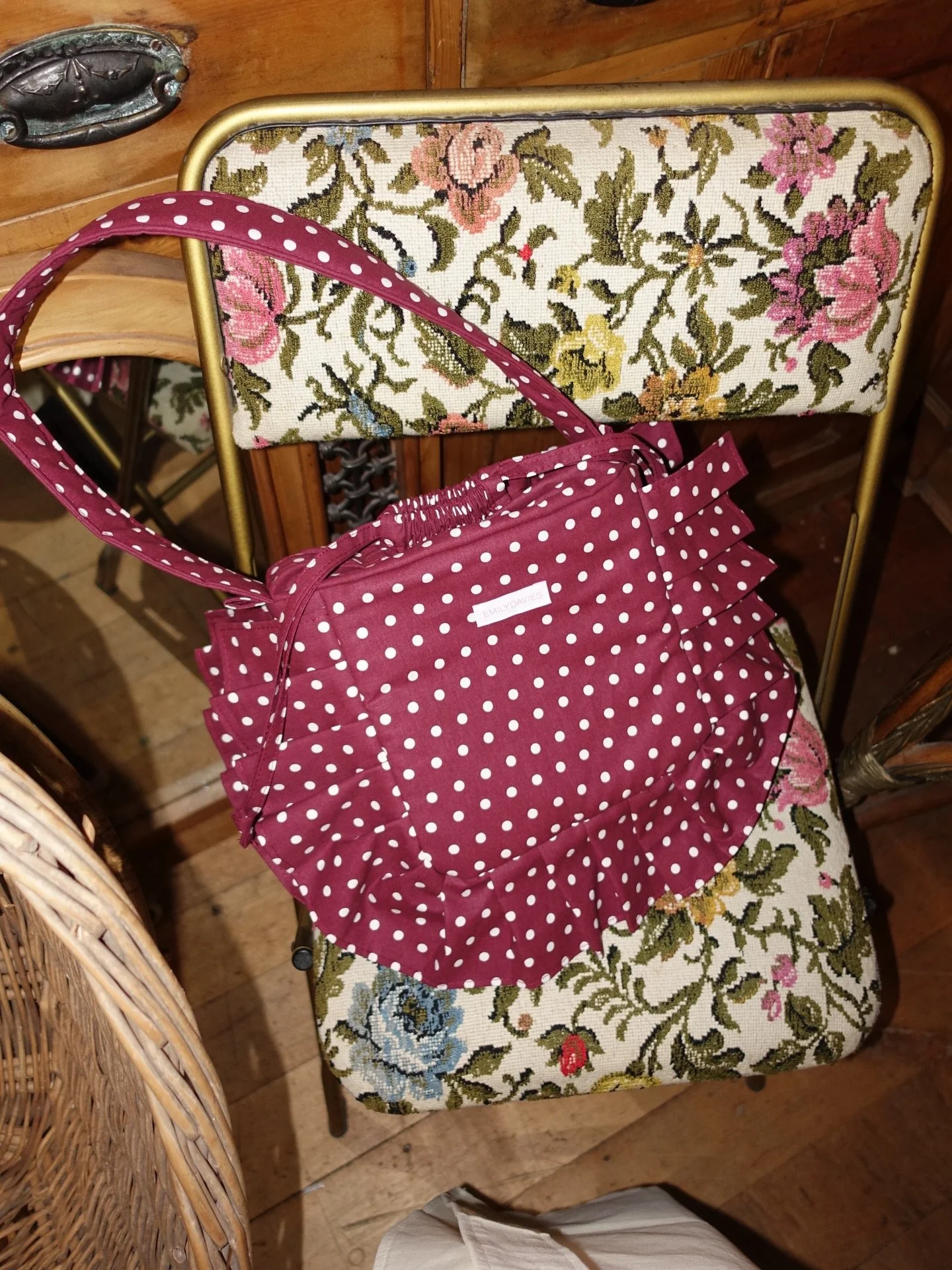 The Evangeline Baby Puffy Shoulder Bag is a one of one piece, made using deadstock cotton in burgundy and white polka dot print. Pattern drench is a signature at Emily Davies Shop, it&rsquo;s chic but makes an impact. The bag features a shoulder stra