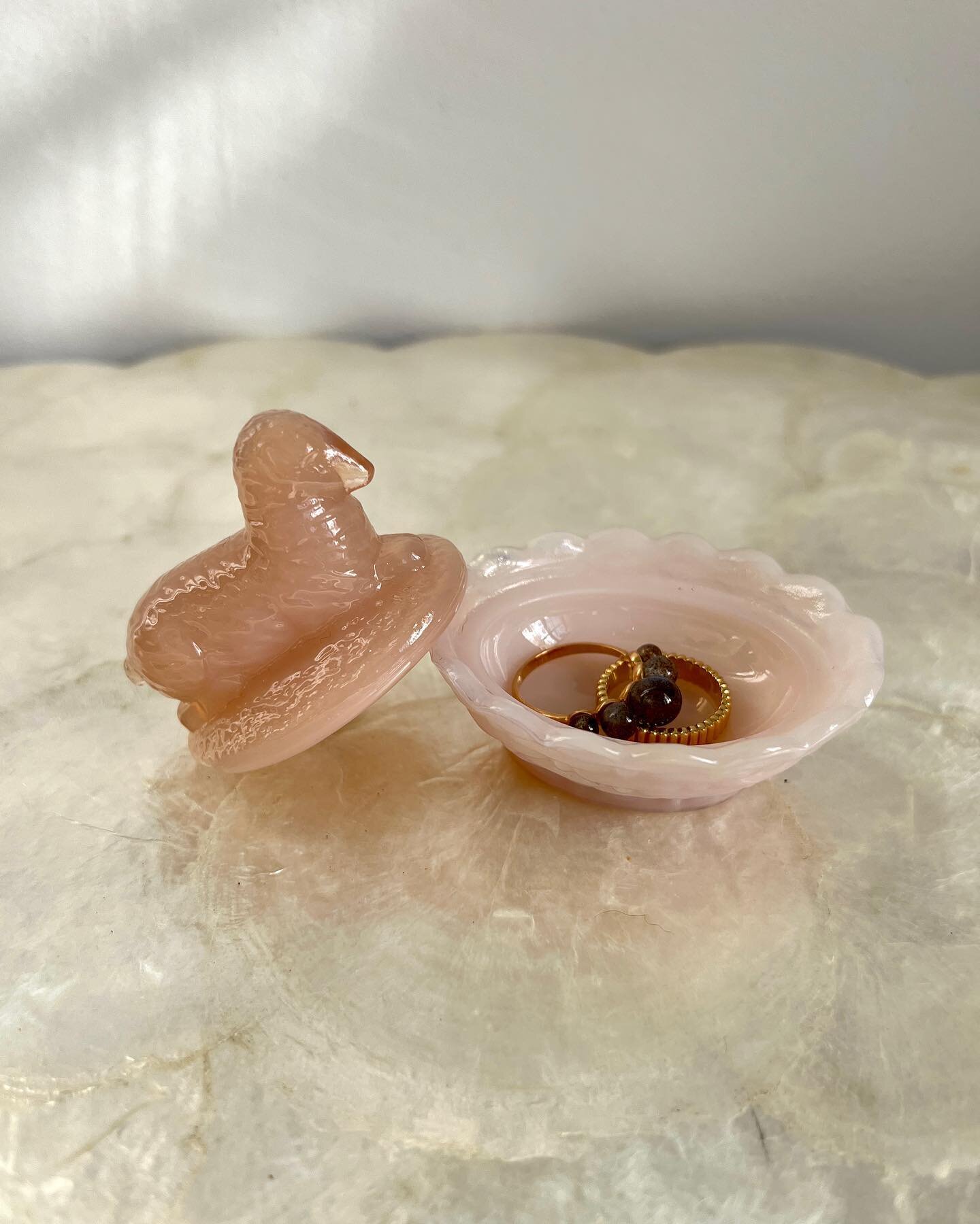A mini glass stasher depicting a lamb atop a basket. The milk glass brings the opaline quality to the pink shade and the scalloped edges adds delicacy.

W 2&rdquo; / L 2.5&rdquo; / H 2.25&rdquo;

&bull; Pink Glass Lamb Basket Chamber &bull; $52

For 