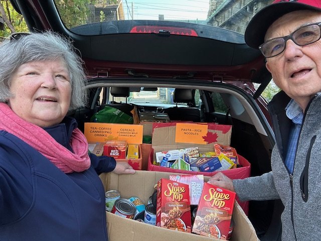 Judy and David pack up the food for delivery