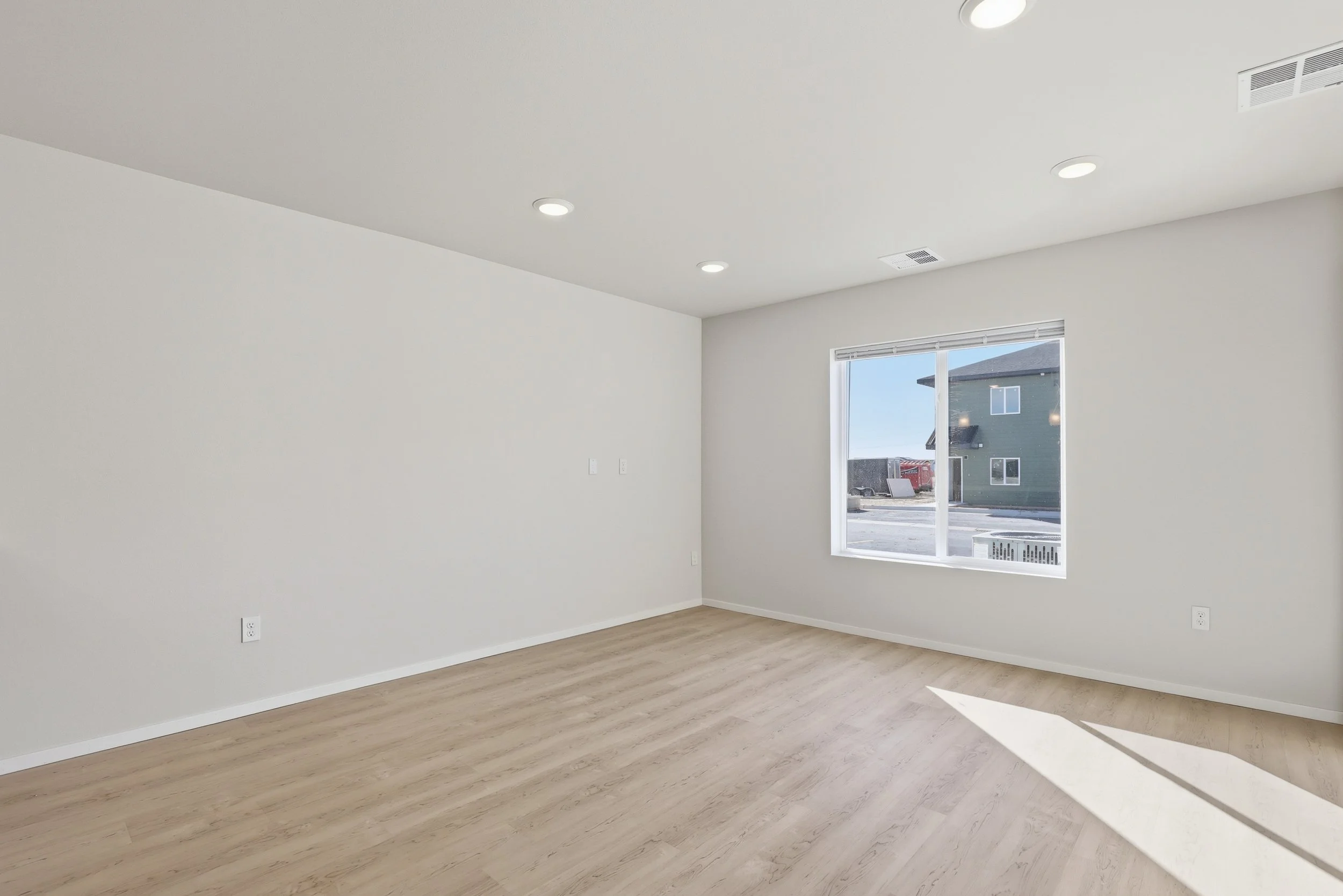 Kitchen and dining area in a similar completed two-bedroom apartment