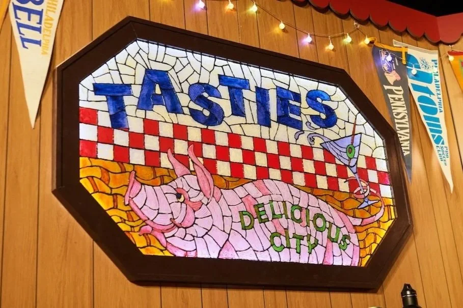 The Tasties stained glass on stage