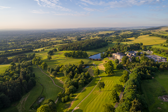 Aerial view over Shrigley Hall Hotel estate and to the countryside beyond