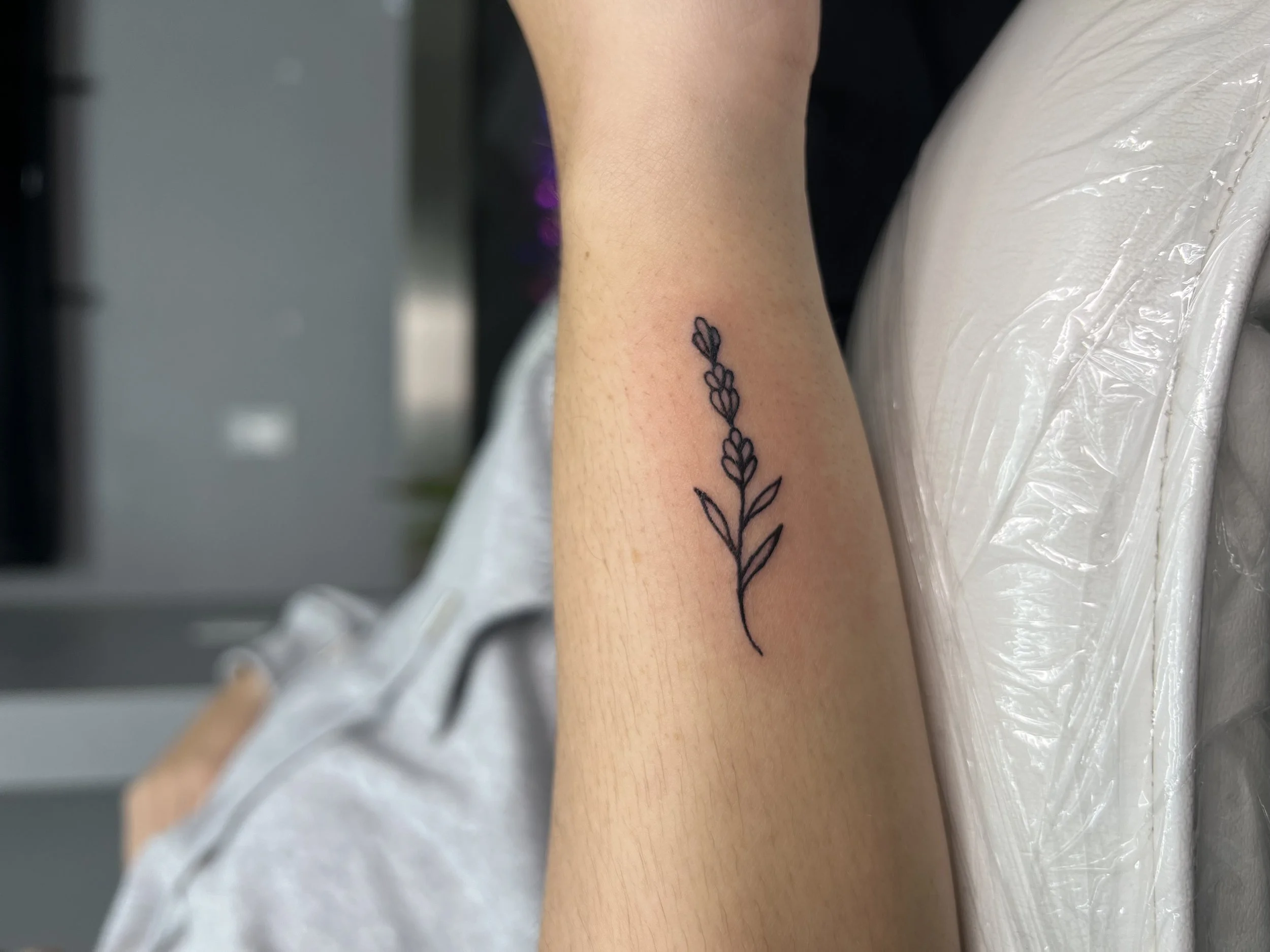 Lavender fine Line small tattoo.