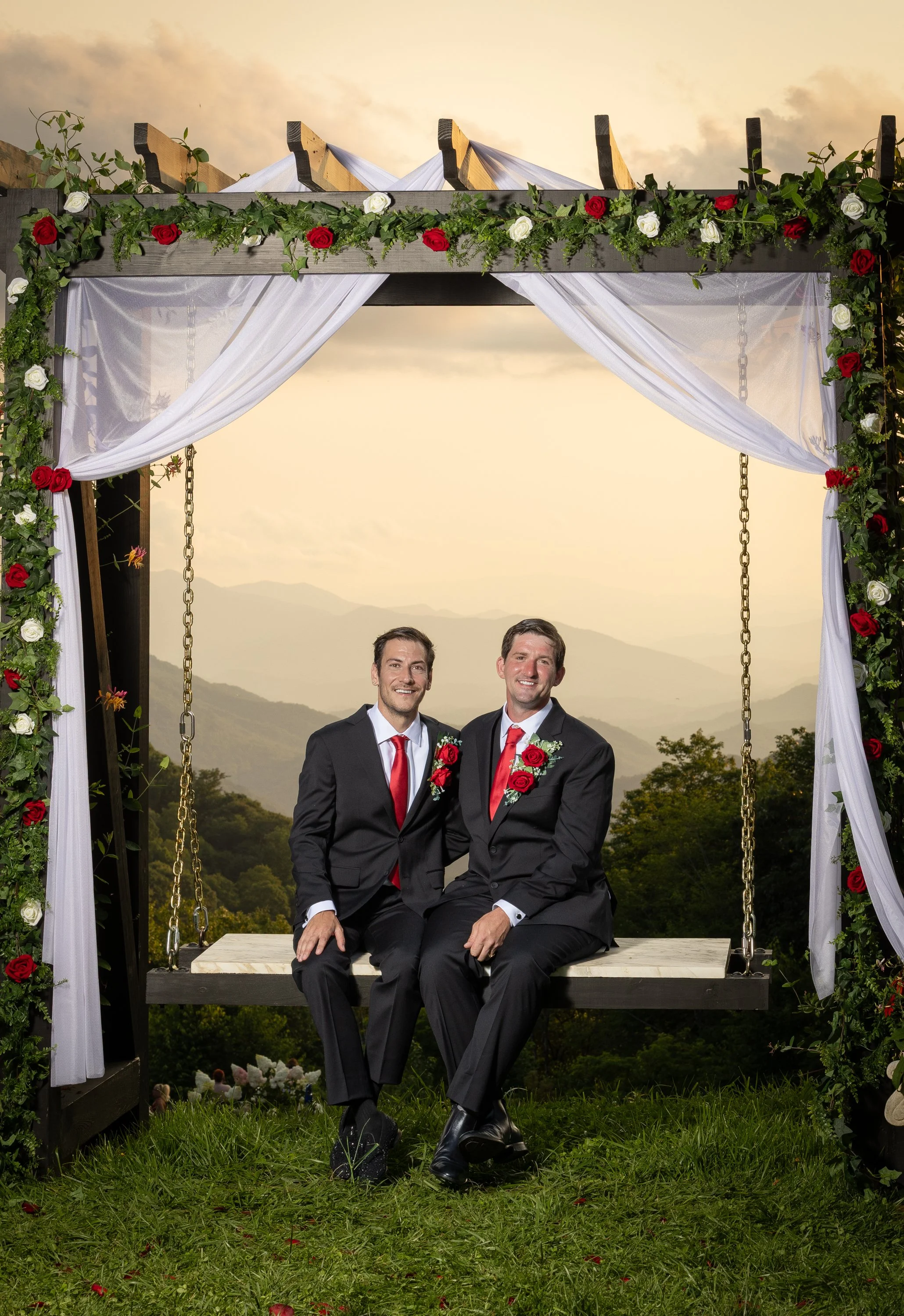 Two grooms enjoy a beautiful sunset just after their wedding. LGBTQ+ friendly wedding photography in Maggie Valley North Carolina. 