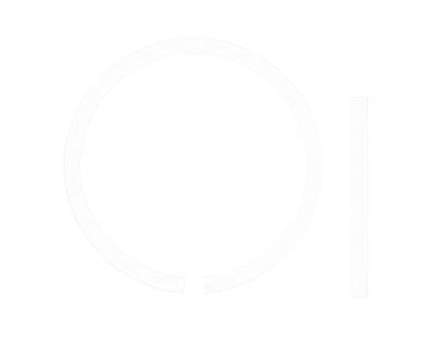 A top-down view of a round, black object with white markings, possibly a vape or electronic device, on a black background.