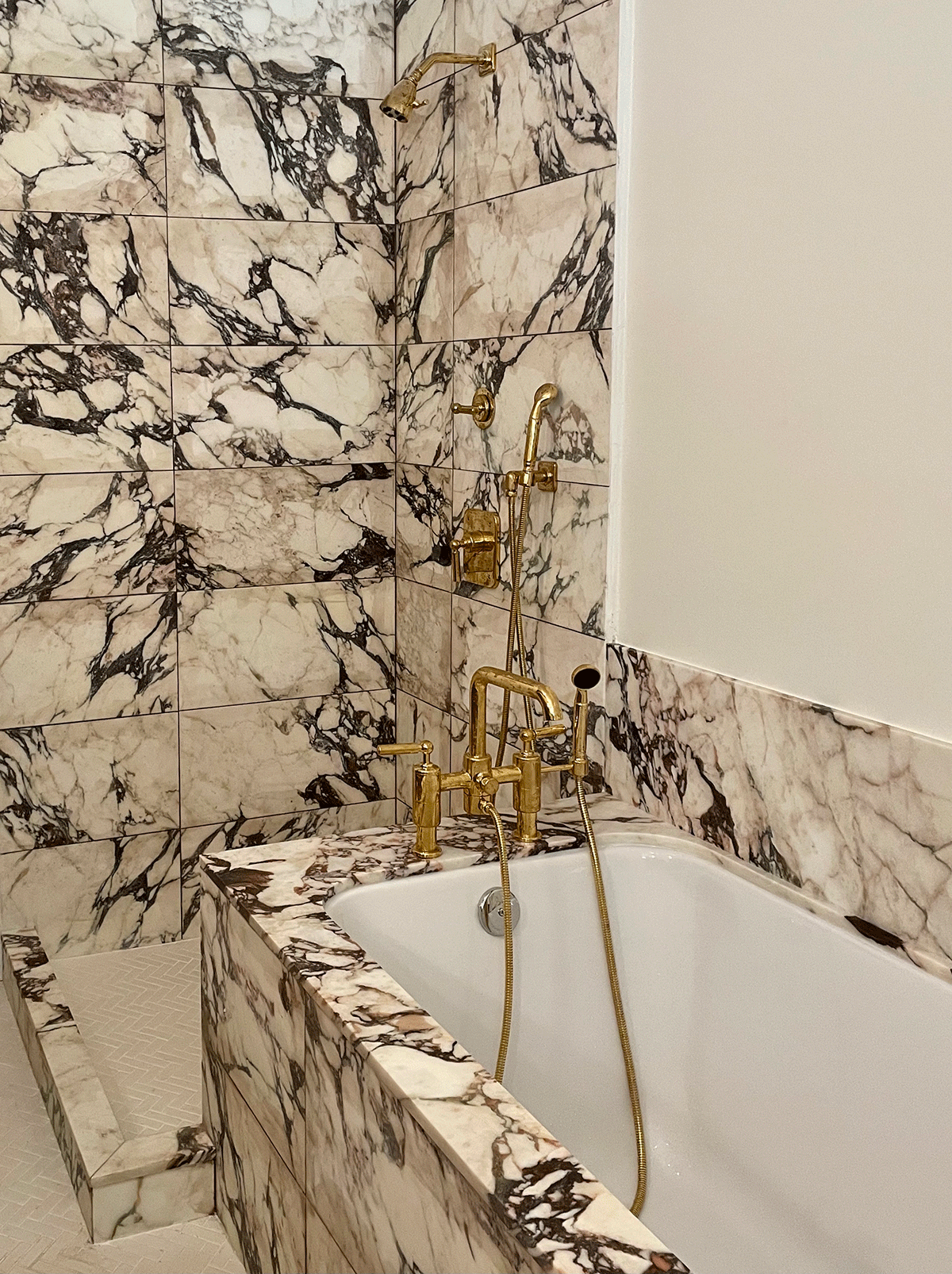 Close up of bathroom tile and hardware