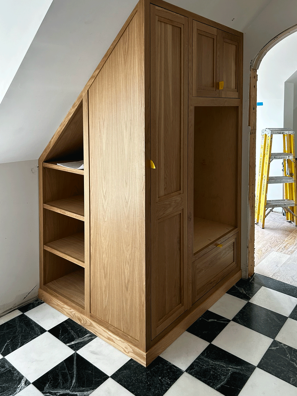 Details built in being installed in a room with black and white checkered tile