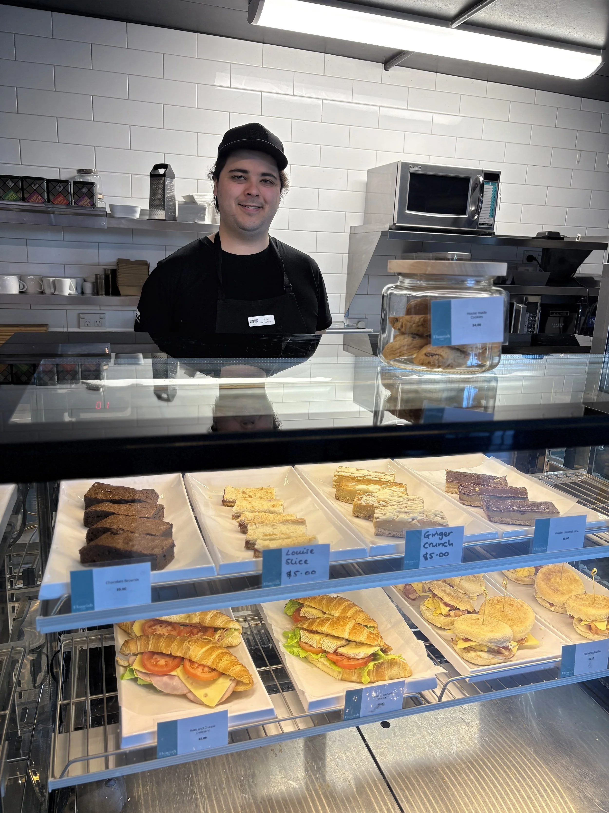 Kyle with Cabinet food in Flourish Cafe