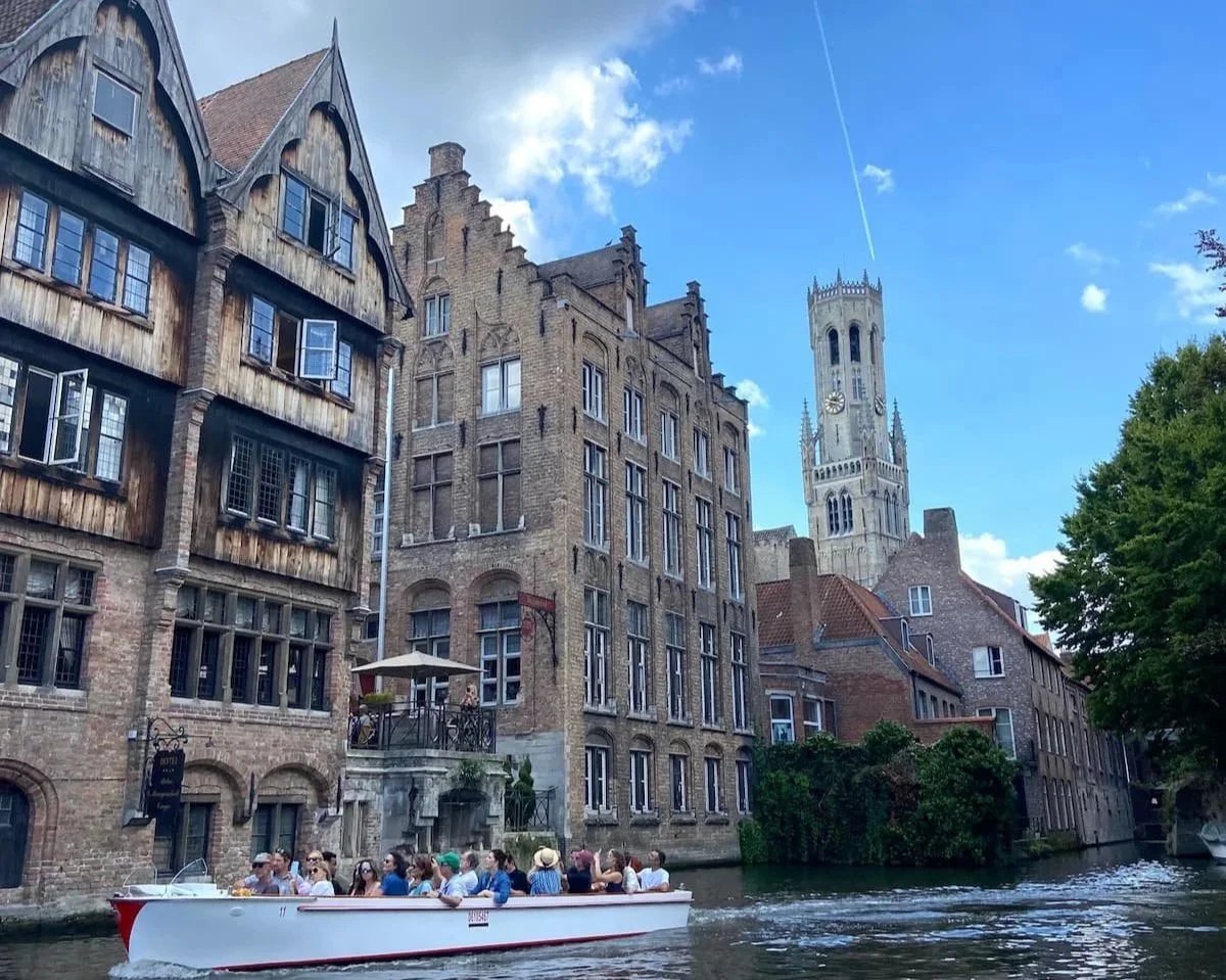 Canal boat tour in Bruges, Belgium during my Europe trip using Holafly eSIM