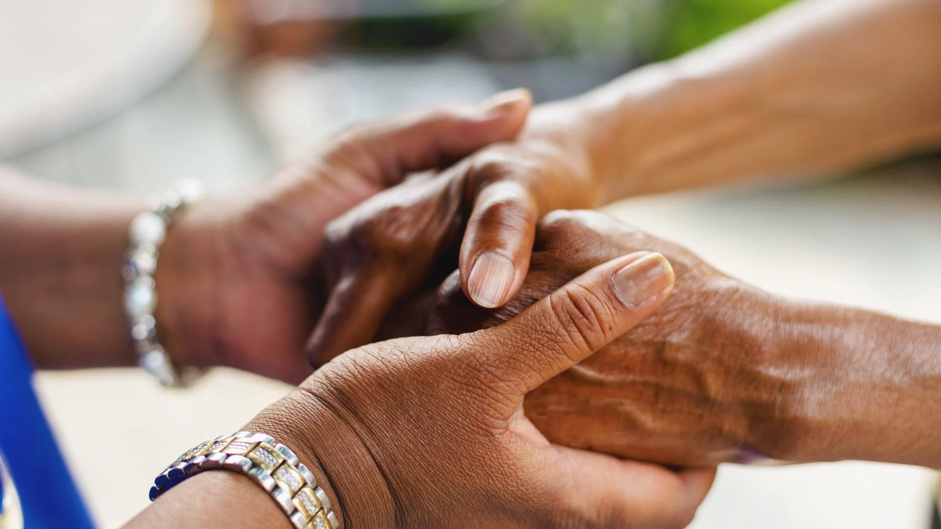 HOLDING HANDS, CAREGIVER, ELDERLY CARE.jpg