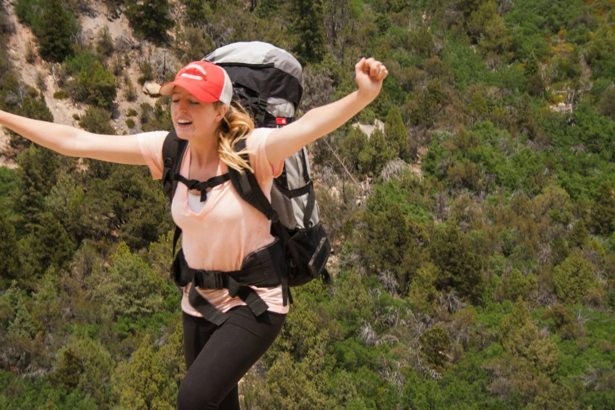 Chelsea Howells celebrating her first backpacking trip; climbing the sucky hill out of Ashdown Gorge.