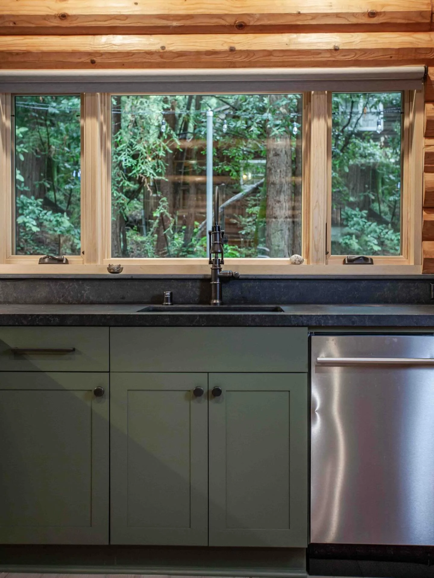 A beautiful thing about Northern California is that you can be on the beach at an oyster shack, then turn around and walk into a redwood grove. This little log cabin nestled in the trees less than a mile away from the pacific ocean endured a renovati