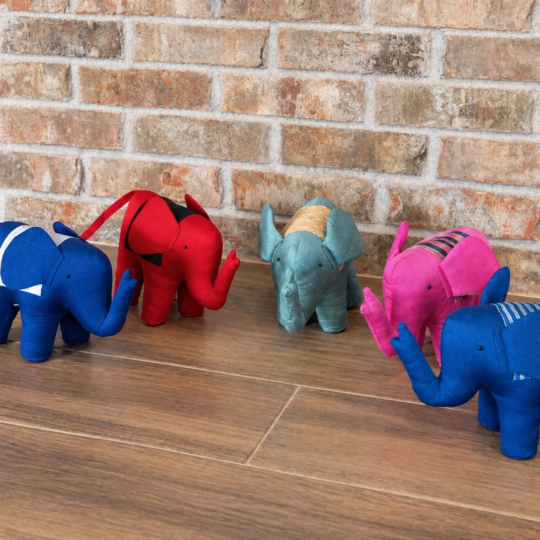 Colorful Fabric Elephants Against Brick.jpg