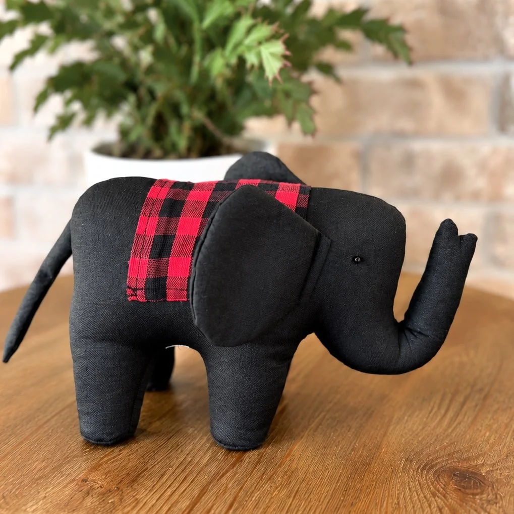 Plaid Elephant on a Wooden Table.jpg