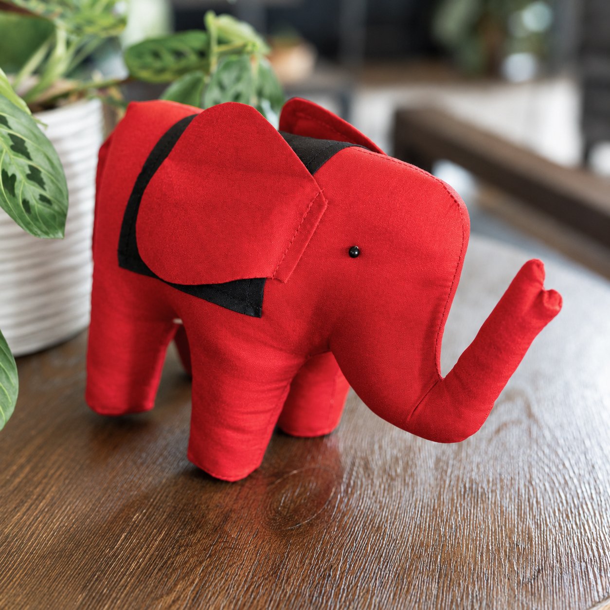 Red Fabric Elephant on Wooden Table.jpg