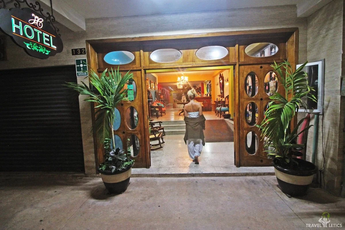 Woman walking into Hotel Mary Carmen entrance Cozumel