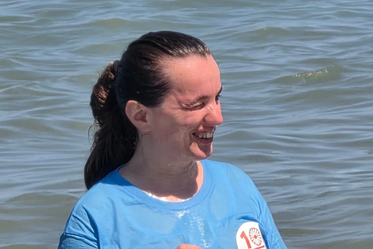 Joy on the Durrës shore after a baptism at camp
