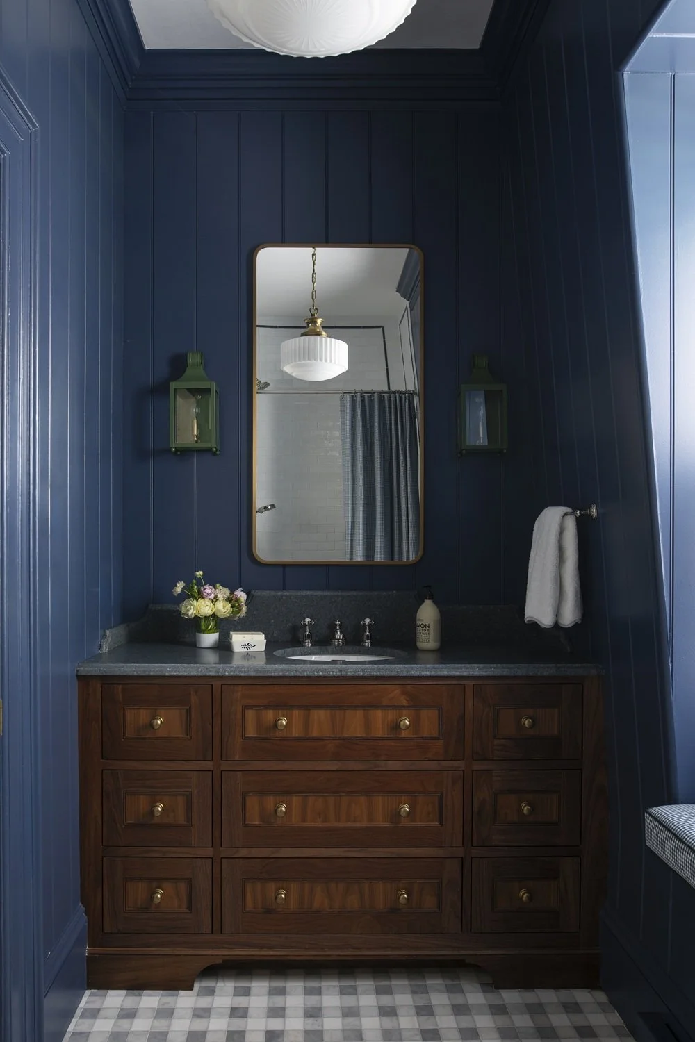 Sherborn kid's bathroom with custom tile design, blue and white tile, gingham marble floor, walnut vanity, beadboard on walls
