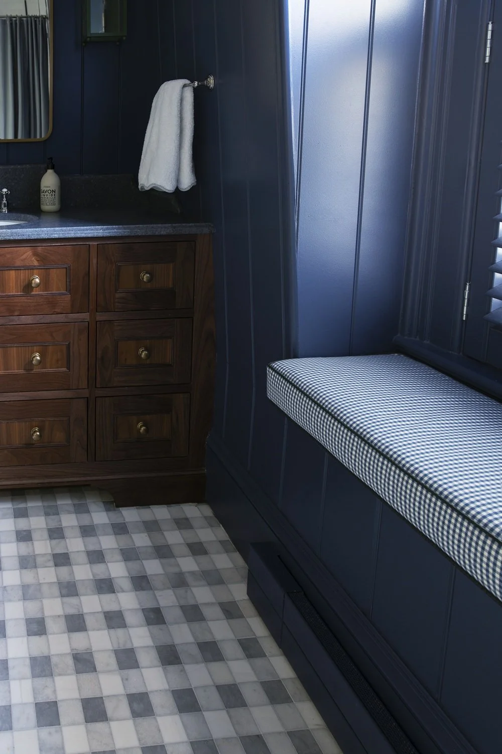 Sherborn kid's bathroom with custom tile design, blue and white tile, gingham marble floor, walnut vanity, beadboard on walls