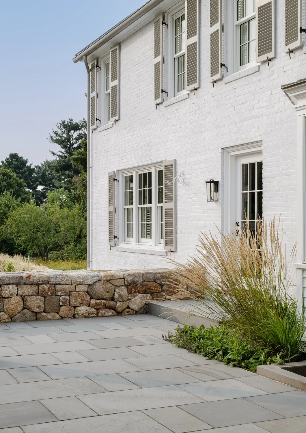 best landscape designer near boston, best landscape architect near boston, best pool company near boston, best pool installation, best landscape design in new england, custom trellis, blackeyed susans, white brick, stone walls