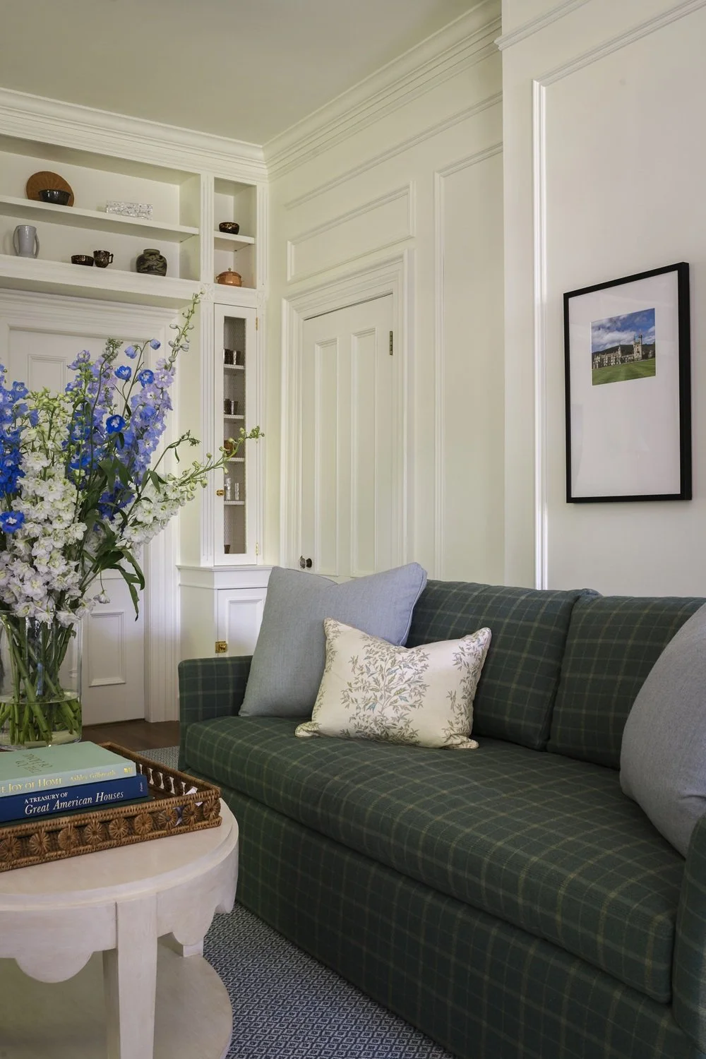 Sherborn living room with green sofas and built-in bookcases, scalloped coffee table, historic design, traditional design, classic design