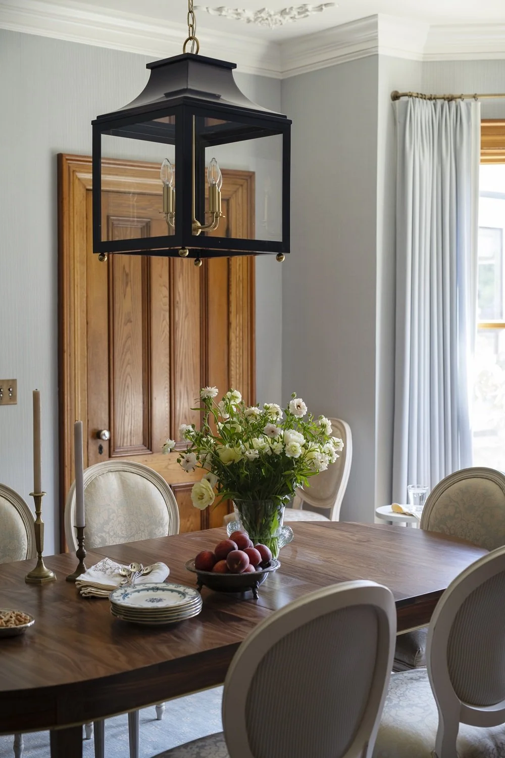Sherborn dining room with custom walnut dining table, Louis IX chairs, antique sideboard, blue lantern, custom drapery, historic design, traditional design, classic design