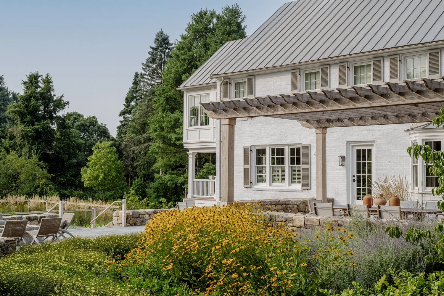 best landscape designer near boston, best landscape architect near boston, best pool company near boston, best pool installation, best landscape design in new england, custom trellis, blackeyed susans, custom landscape design, dry stack stone walls
