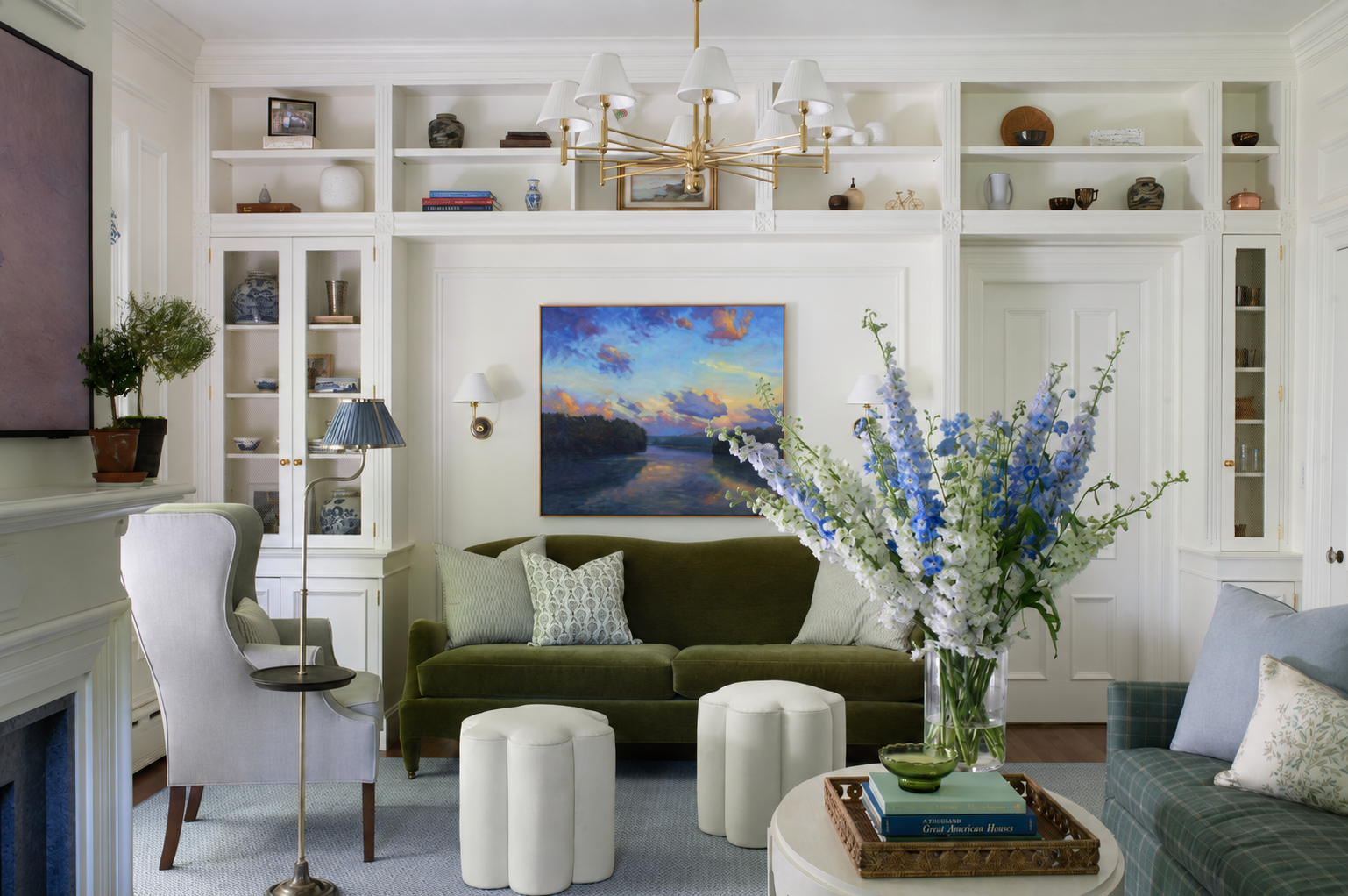 Sherborn living room with green sofas and built-in bookcases