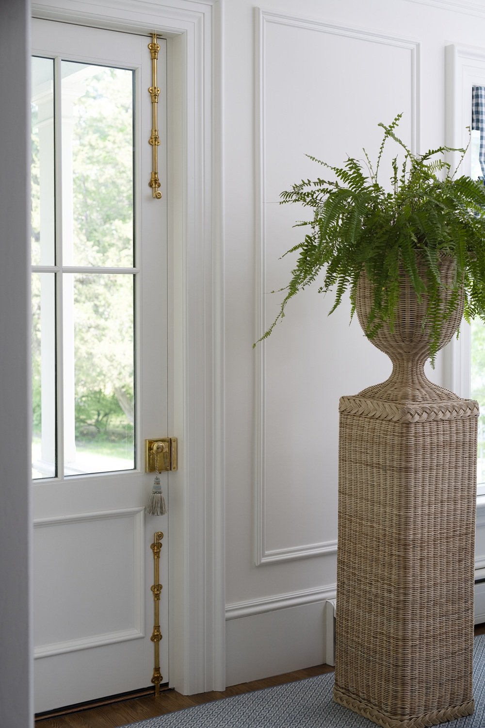 Sherborn living room with wicker plant stand and fern, historic design, traditional design, classic design, rim lock on door