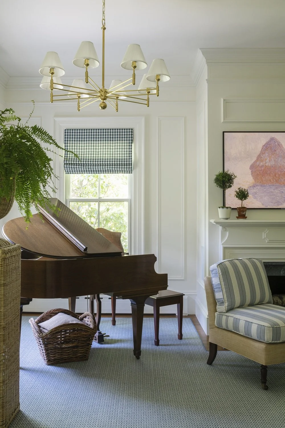 Sherborn living room with custom fireplace mantle, striped chair, baby grand piano, custom fit wool rug, motorized roman shades, brass chandelier, historic design, traditional design, classic design