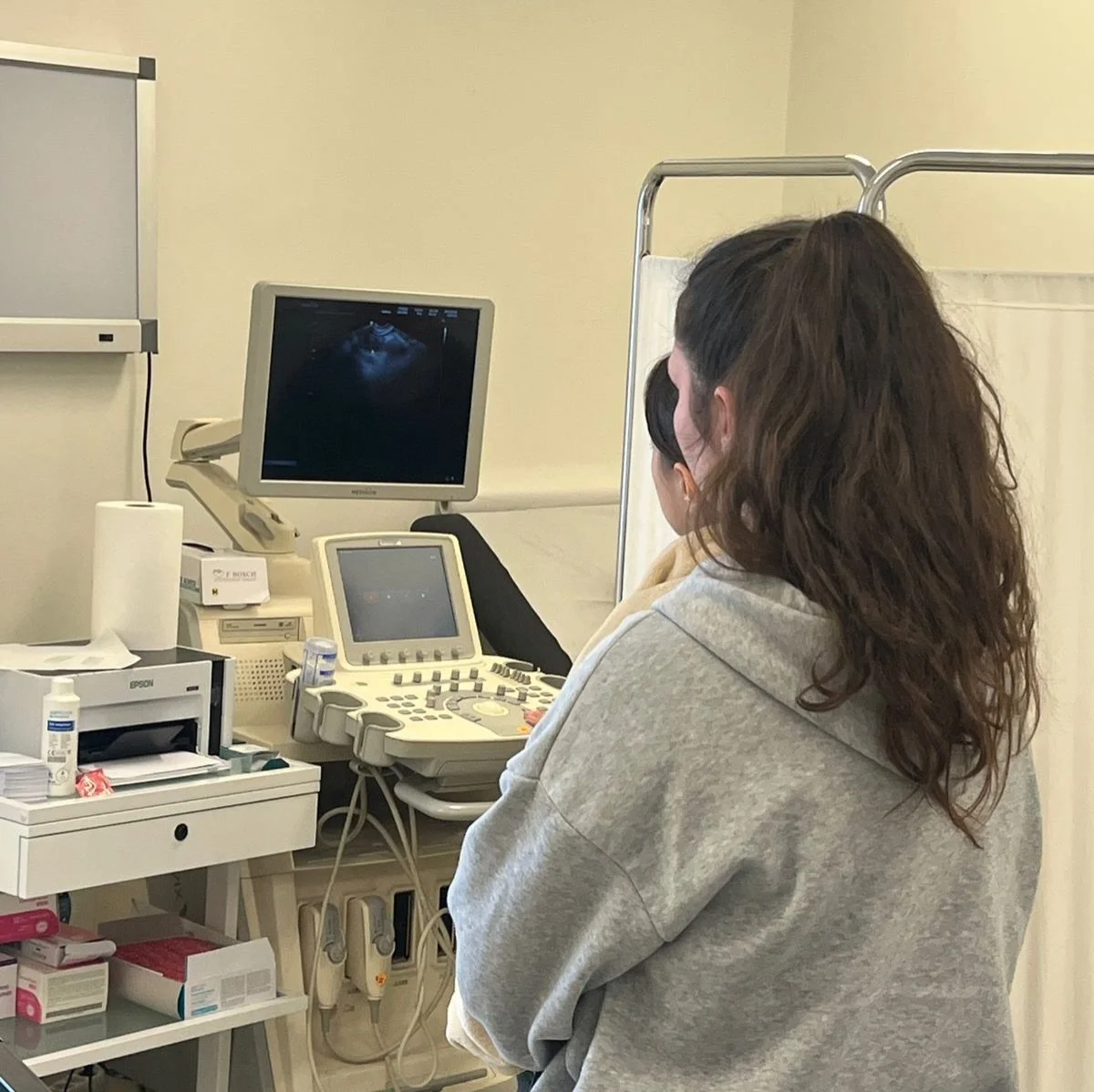 A woman looking at an ultrasound scan.