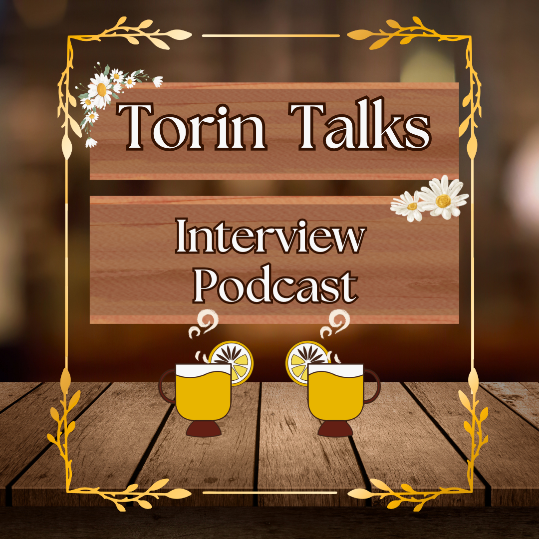 White text reads "Torin Talks: Interview podcast" with wooden backgrounds and daisies dotting the corners. There are two hot toddy drinks underneath on a table, with gold filigree outlining the entire image. 