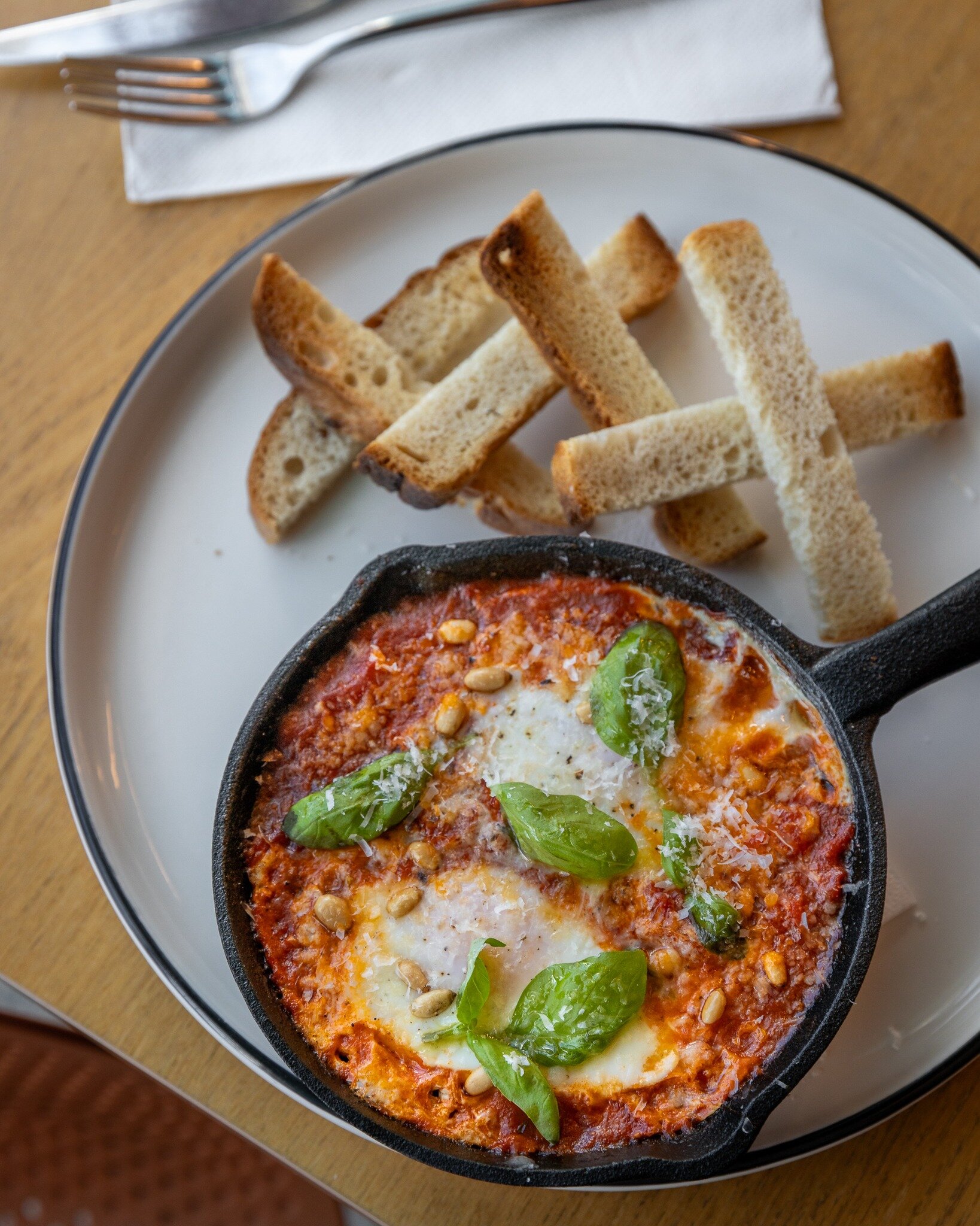 The Shakshuka breakfast is served straight from the over ♨️ Tangy tomato, chilli, garlic, red onion, red capsicum and free-range eggs, topped with freshly grated parmesan cheese, pine nuts, basil and toasted sourdough 🍅

Open Tue-Sun for breakfast, 