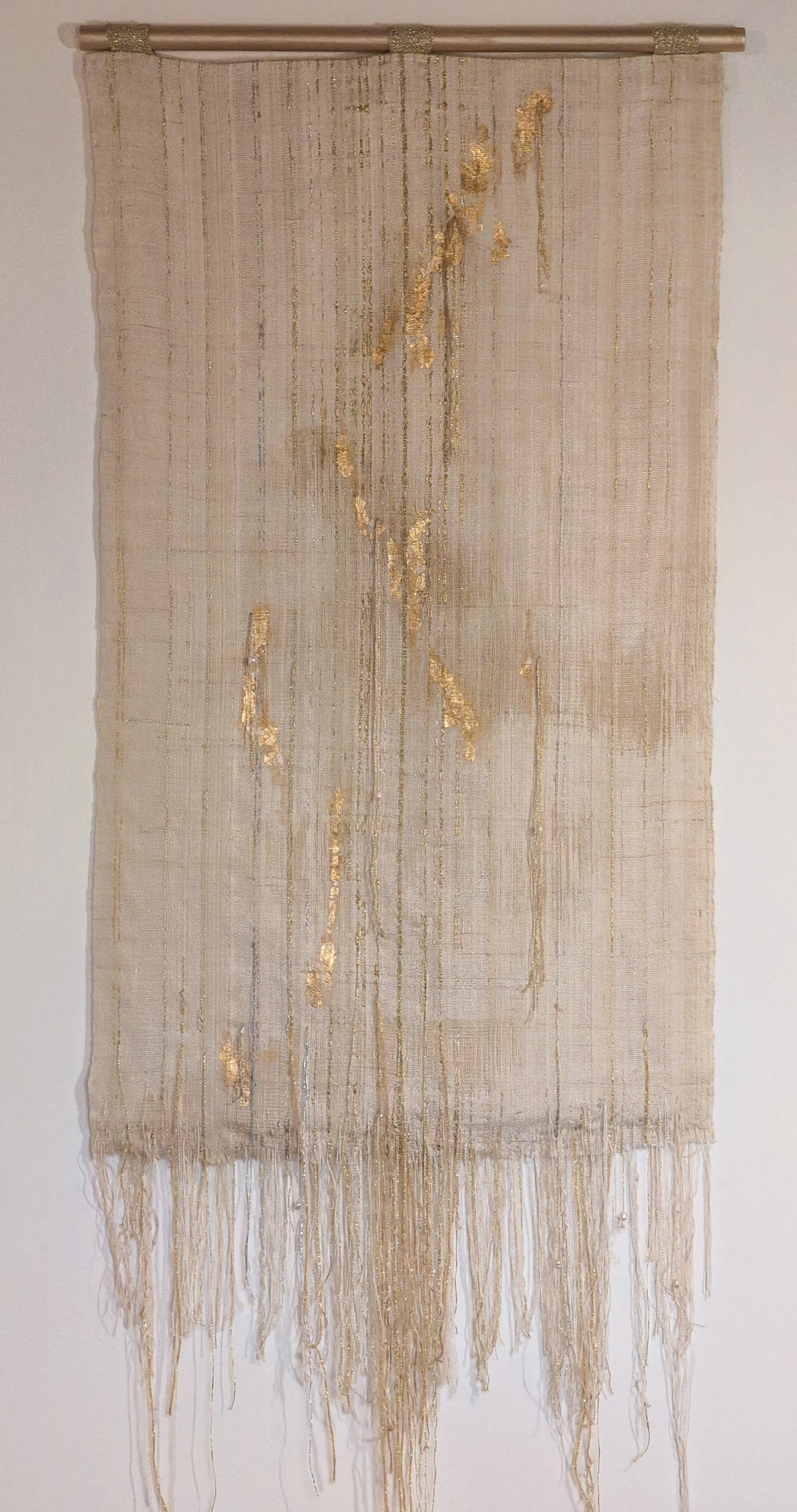 Bringing in the Light. Handwoven textile with gold leaf, fabric pigments, embellished fringe.  23x50".  2026