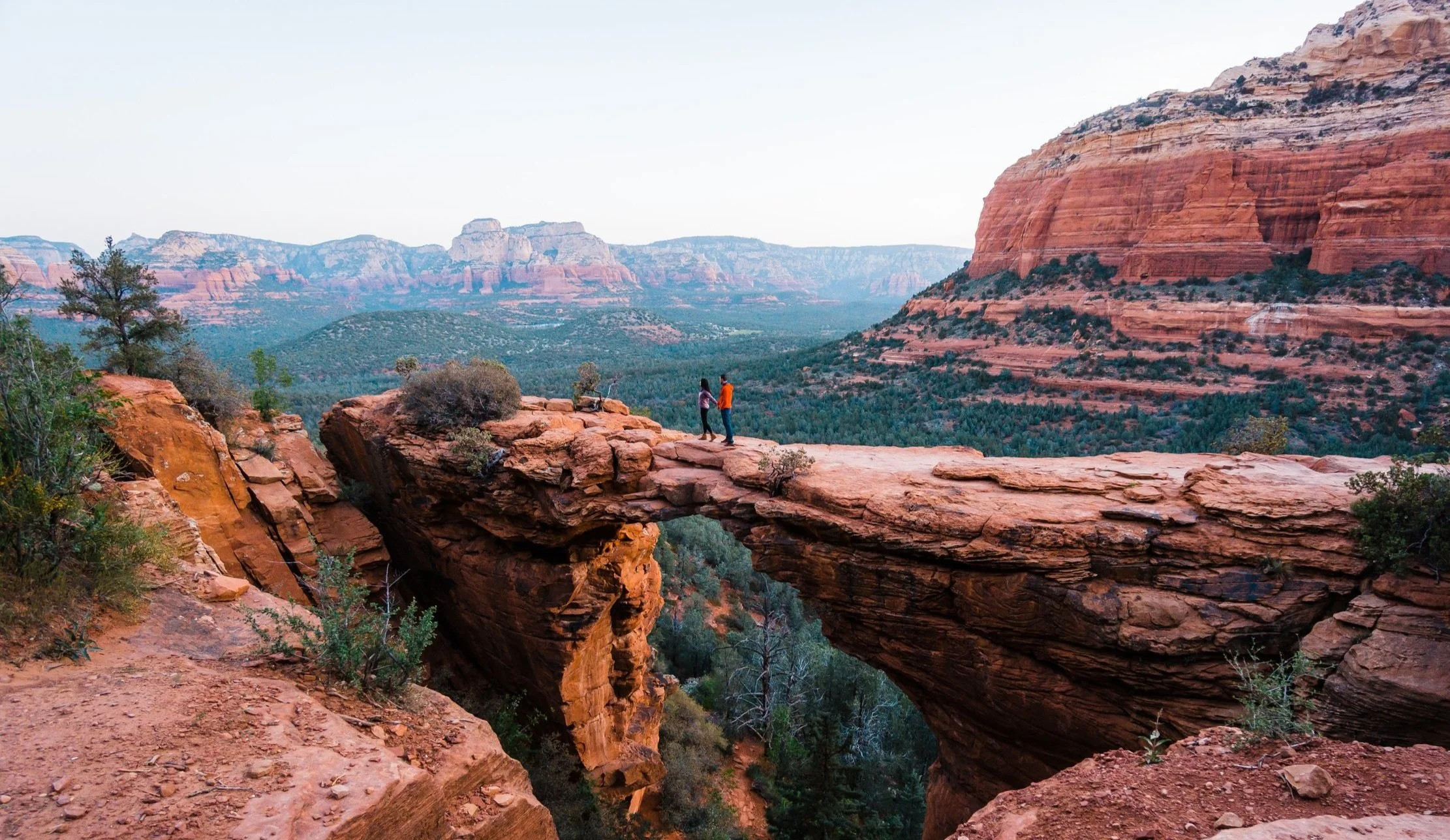 couple stating at devils bridge sedona arizona
