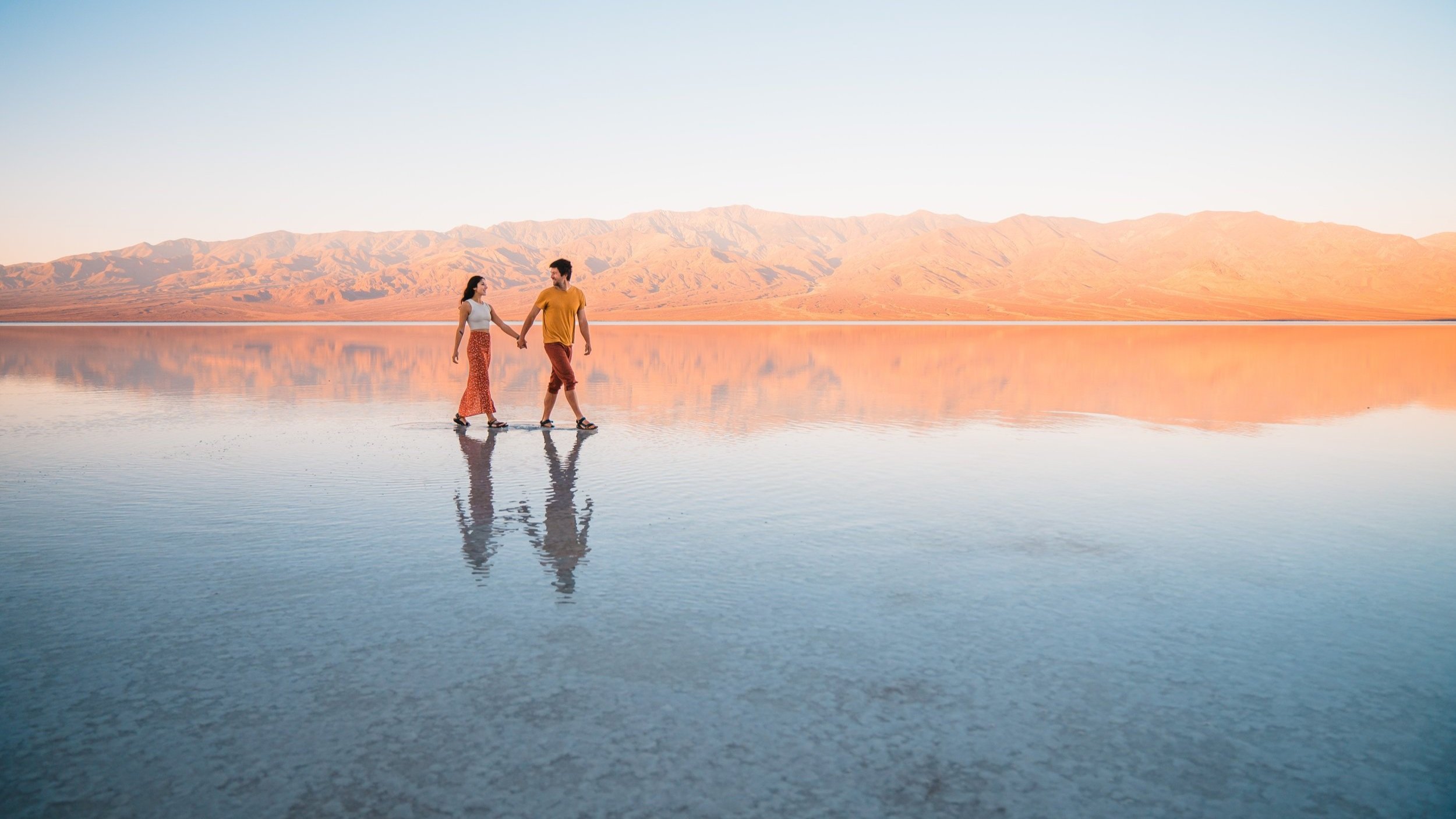 Walking on the temporary salt flat lake at badwater basin