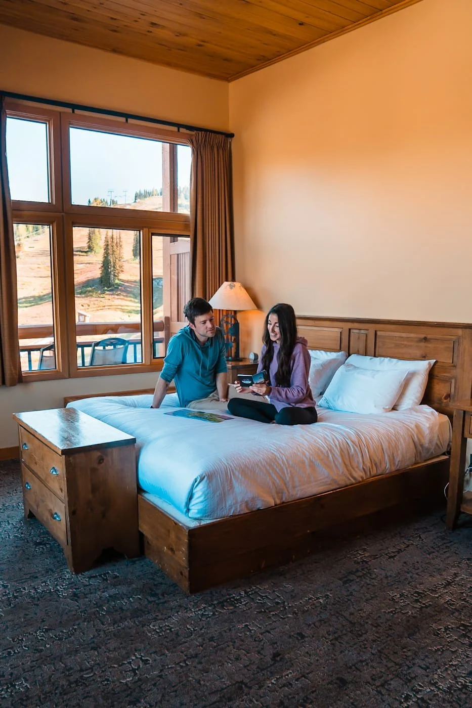 Couple planning their daily itinerary at the Sunshine Village Lodge